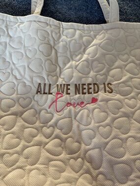 NWOT All We Need Is Love Quilted Tote - Cream with Pink Script